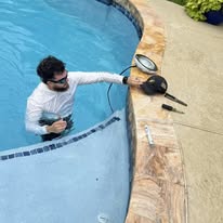 Jeff Electric technician working near a residential pool